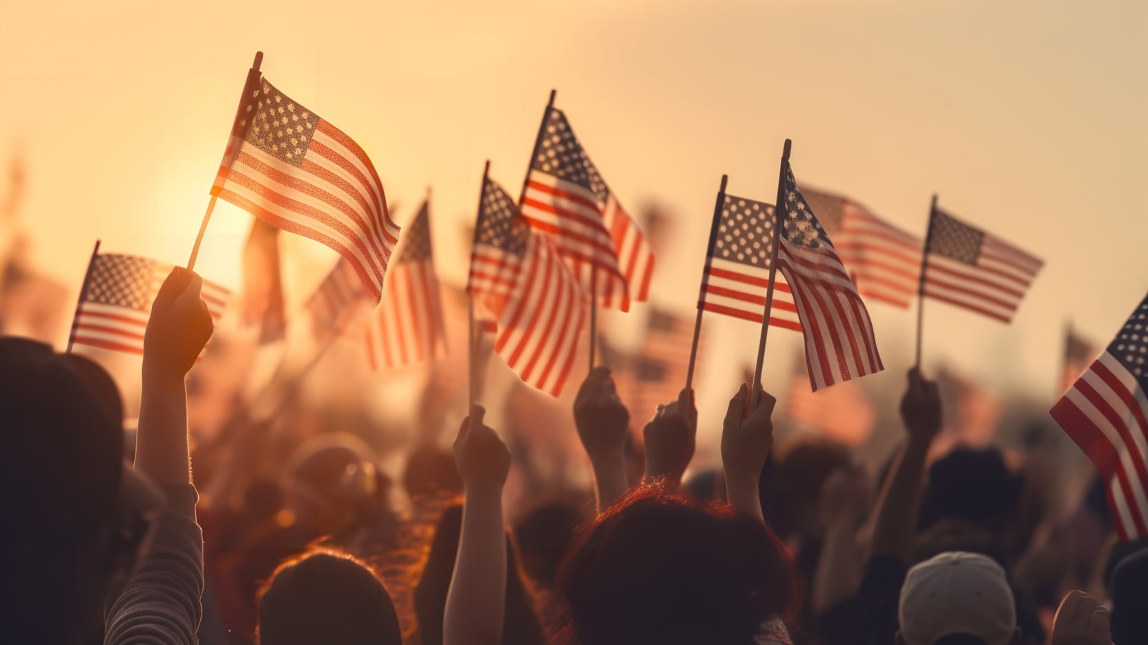 Group of people waving American flags